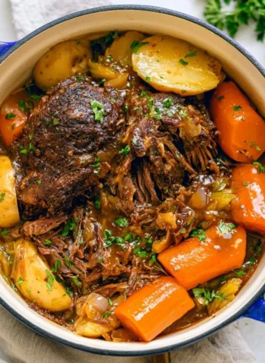 Delicious and hearty cozy pot roast served with vegetables