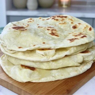 Cozy sourdough discard tortillas on a wooden board with toppings