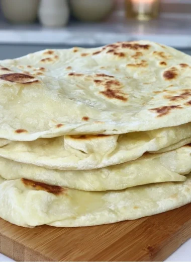 Cozy sourdough discard tortillas on a wooden board with toppings