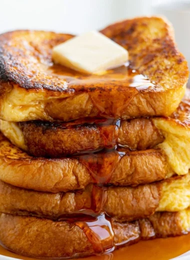 Deliciously cooked Easy French Toast with syrup and berries on a plate
