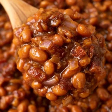 Delicious Easy Ultimate Baked Beans ready to serve on a table.