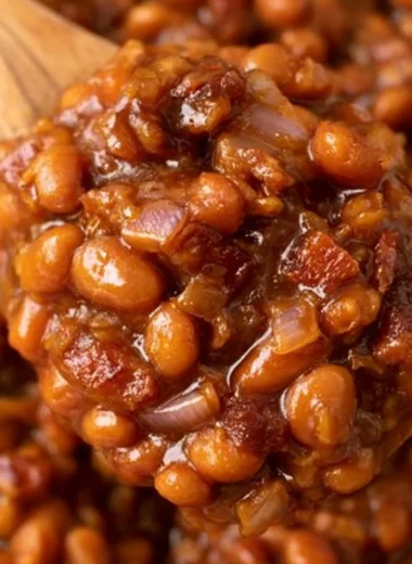 Delicious Easy Ultimate Baked Beans ready to serve on a table.