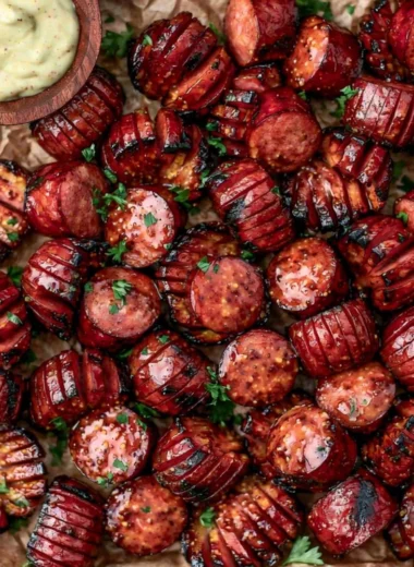 Mustard Hasselback Kielbasa Bites ready to serve as a delicious appetizer.
