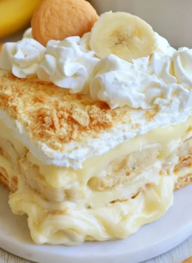 A delicious bowl of the best banana pudding topped with whipped cream