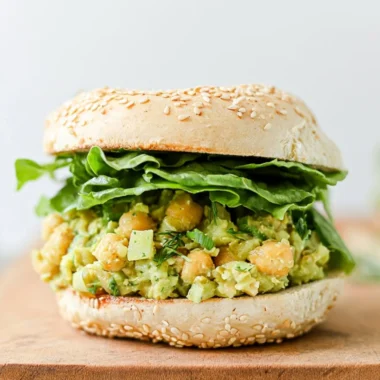 Vegan Chickpea Avocado Sandwich on whole grain bread topped with fresh ingredients.