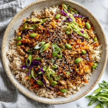 Colorful veggie-packed turkey egg roll in a bowl with fresh ingredients.