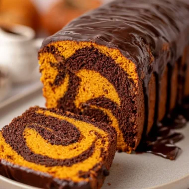 Deliciously cozy vegan pumpkin marble cake on a rustic table.